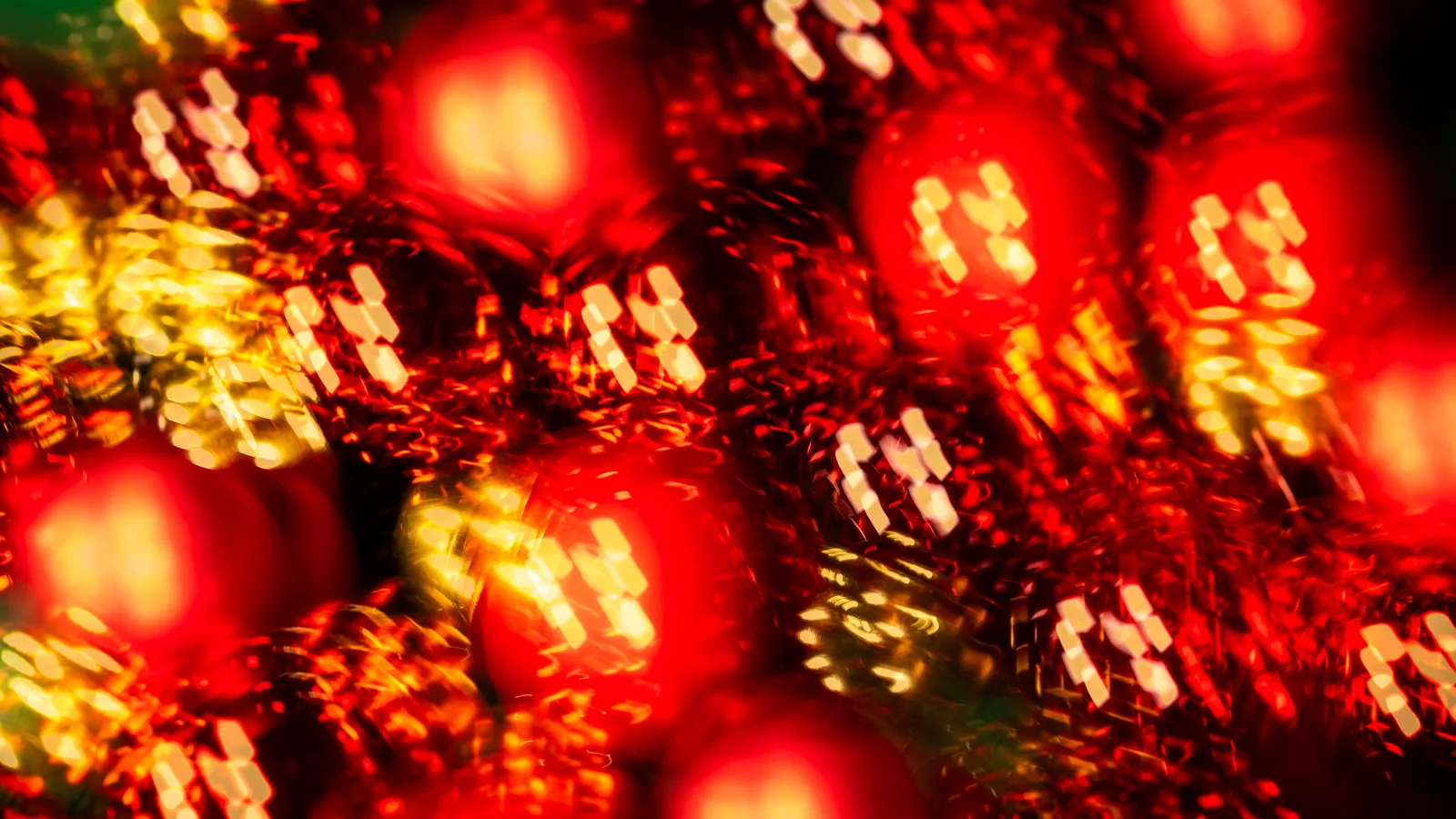Glass Christmas ornaments in gold and red.