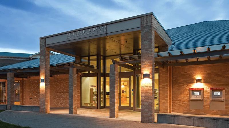 Kirkland Library, a modern building with a glass and wood front and a covered entry.